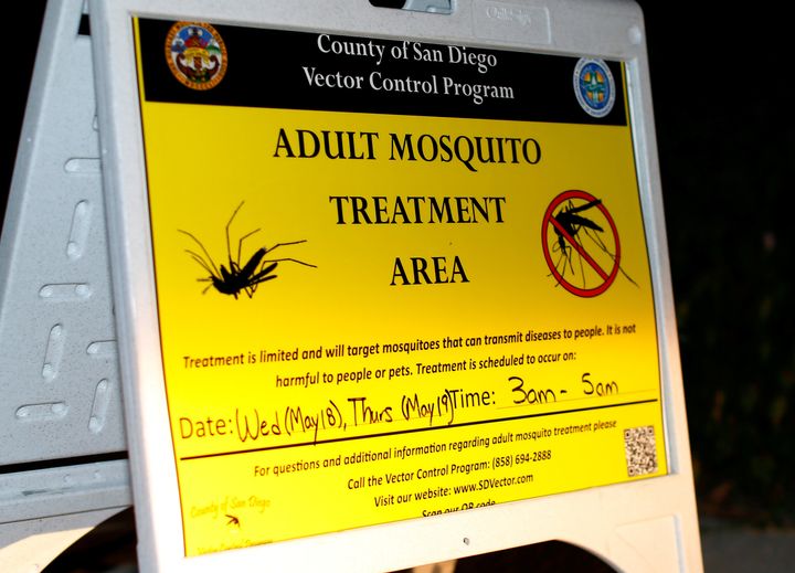 A sign warns residents their neighborhood will be sprayed with pesticide by a vector control team after increasing numbers of mosquitoes have tested positive for West Nile virus in San Diego, California in May 2016.