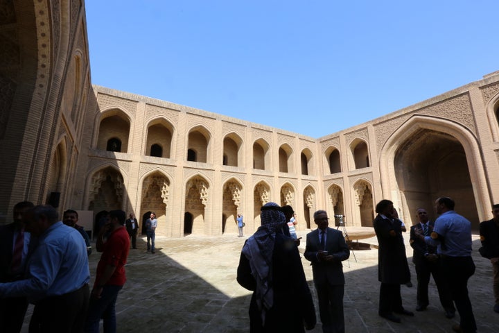 A picture taken on March 12, 2016 shows visitors at Qasr al-Abbasi Palace in the al-Maiden neighbourhood of Baghdad during a ceremony marking one year after the destruction done by the Islamic State group (IS) at the archaeological site of Nimrud.