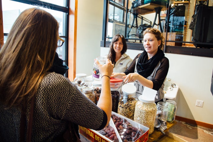 Shoppers can use their own glass jars to scoop out dry goods at Zero Waste Market in Vancouver, Canada.