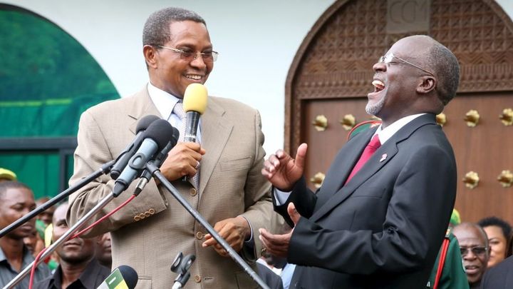 Former Tanzanian president Jakaya Kikwete laughs with his successor, John Magfuli, in 2015.
