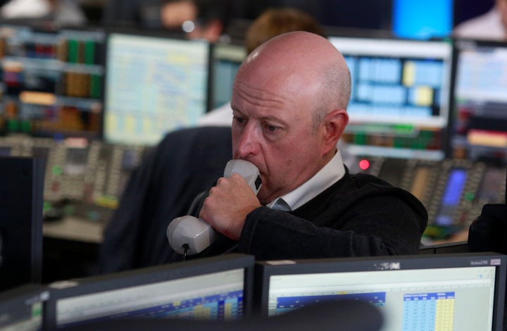 A trader from BGC Partners, a global brokerage company in London's Canary Wharf, waits for European stock markets to open early June 24 after Britain voted to leave the European Union.