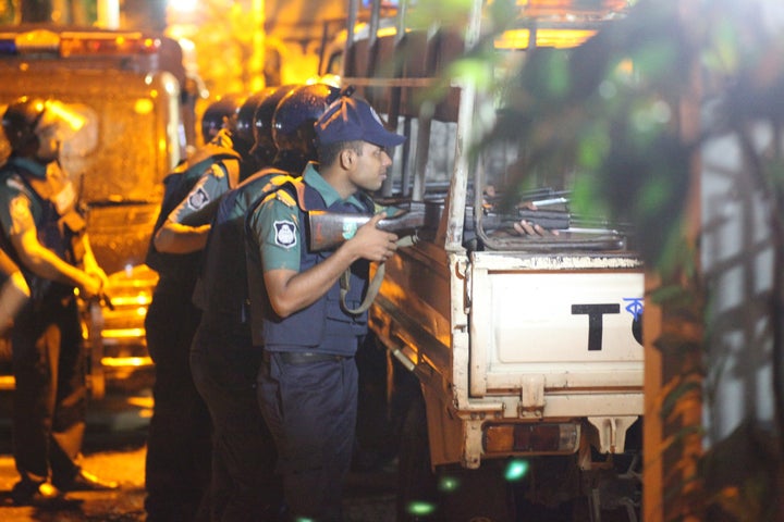 Bangladeshi police stand guard outside the Holey Artisan Bakery cafe where gunmen held hostages in Dhaka, Bangladesh on July 02, 2016.