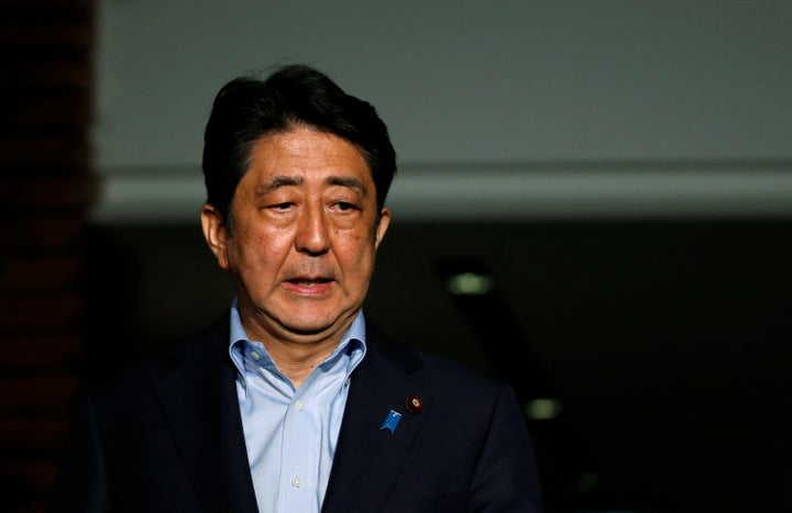 Japan's Prime Minister Shinzo Abe reacts as he speaks to the media at the Prime Minister's official residence in Tokyo, Japan