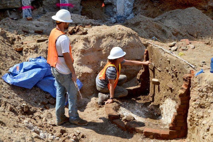 Archaeologists are seen excavating one of the privies uncovered at the site that will be transformed into the Museum of the American Revolution.