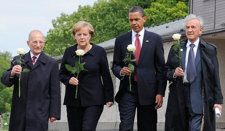 Wiesel is pictured here with U.S. President Barack Obama, German Chancellor Angela Merkel, and fellow Holocaust survivor Bertrand Herz on a visit to the former Buchenwald Nazi concentration camp.