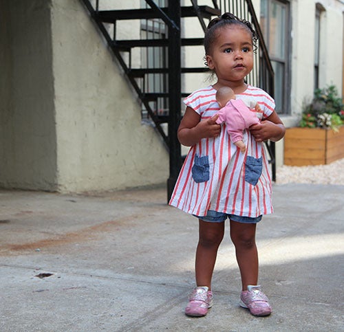 <i>Photo by Nancy A. Ruhling</i><br><strong>Ani with her baby doll.</strong>