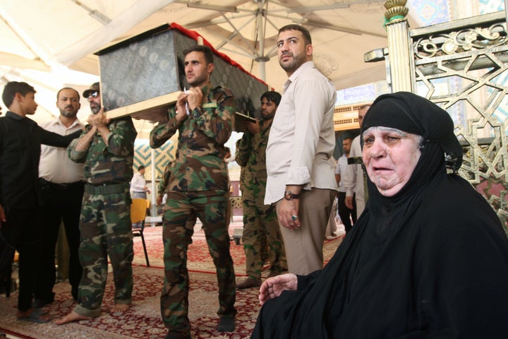 Mourners carry the coffin of their relative, who was killed in a suicide vehicle bomb in the Karrada shopping area in Baghdad