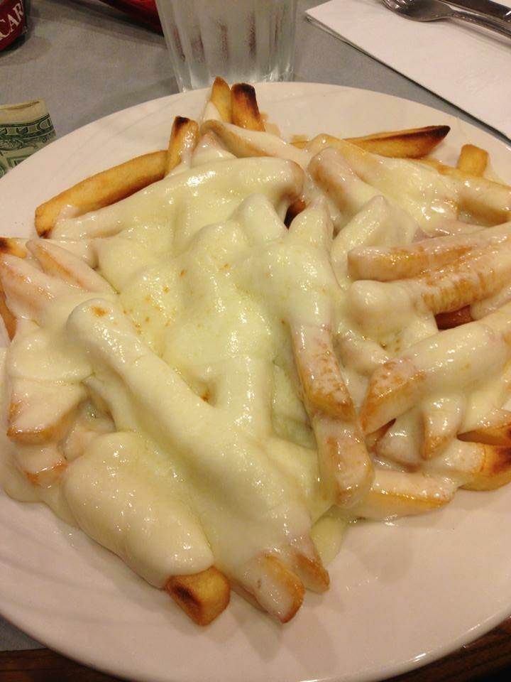 famous and delicious disco fries: french fries with brown gravy and mozzarella cheese