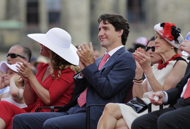 Justin Trudeau, Canada's prime minister, right, and wife Sophie Gregoire Trudeau, left, applaud during Canada Day performances.