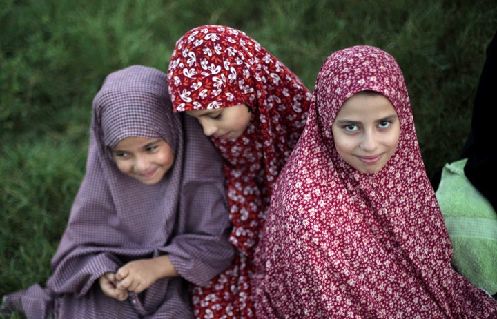 Veiled Palestinian girls attend Eid prayers in Gaza City, 2015 