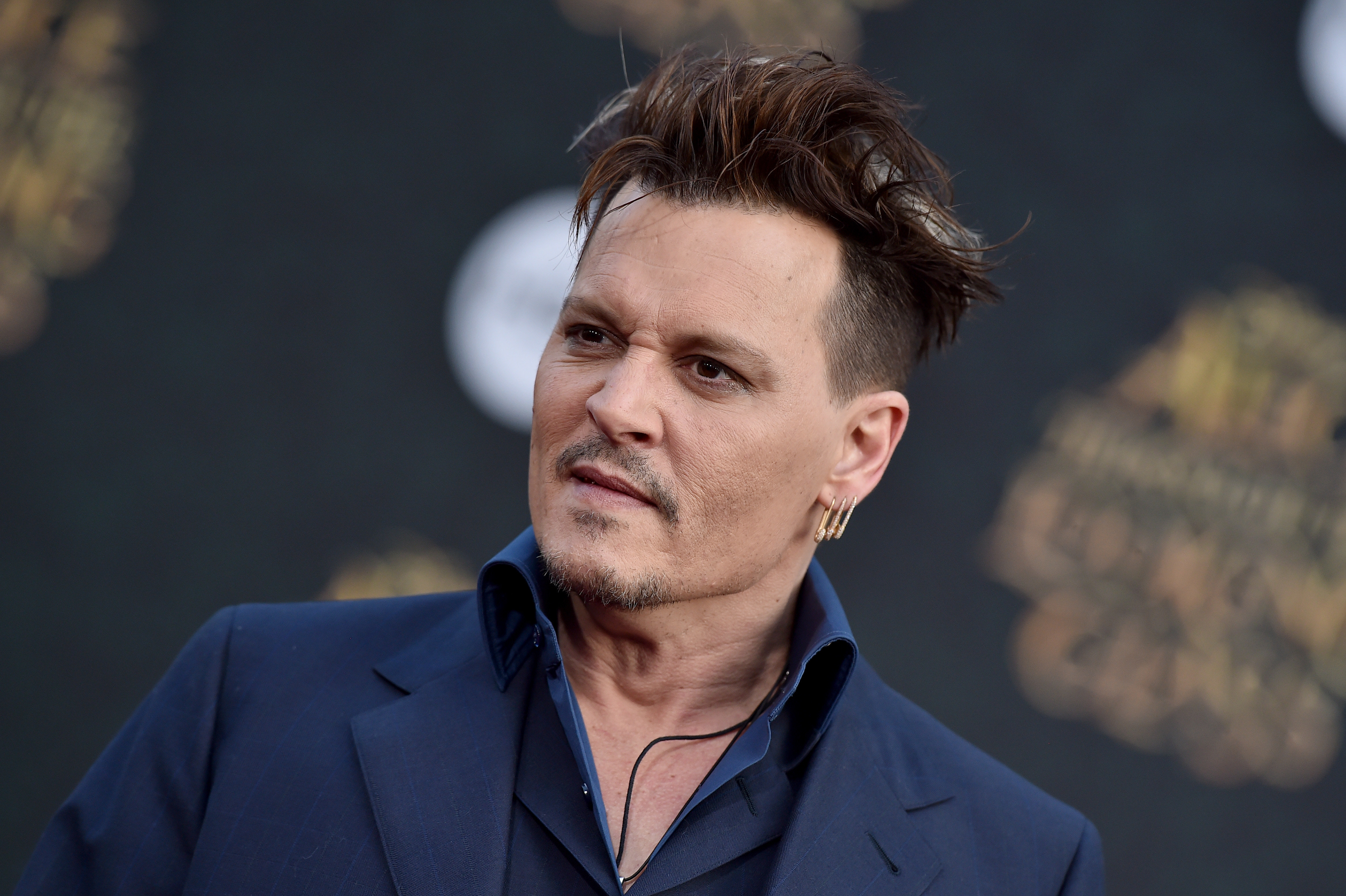 Has Johnny Depp changed Amber Heard tattoo from Slim to Scum