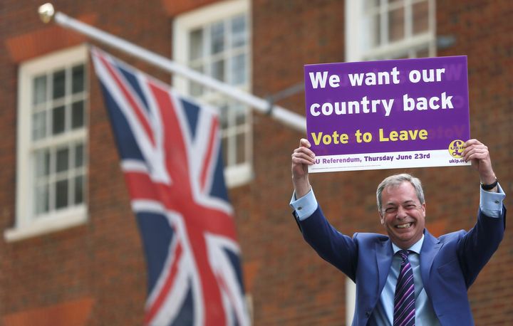 Leader of the United Kingdom Independence Party Nigel Farage holds a placard as he launches his party's EU referendum tour bus in London, Britain May 20, 2016.