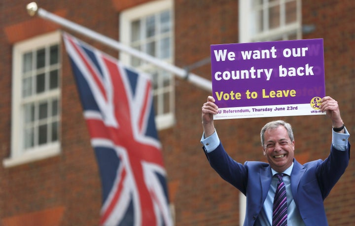 Leader of the United Kingdom Independence Party Nigel Farage holds a placard as he launches his party's EU referendum tour bus in London, Britain May 20, 2016.