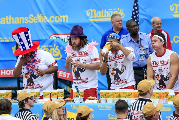 Competitors are seen during Monday's hot dog eating contest in New York on Monday.