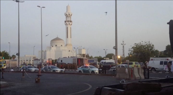 General view of security personnel in front of a mosque as police stage a second controlled explosion near the U.S. consulate in Jeddah, Saudi Arabia.