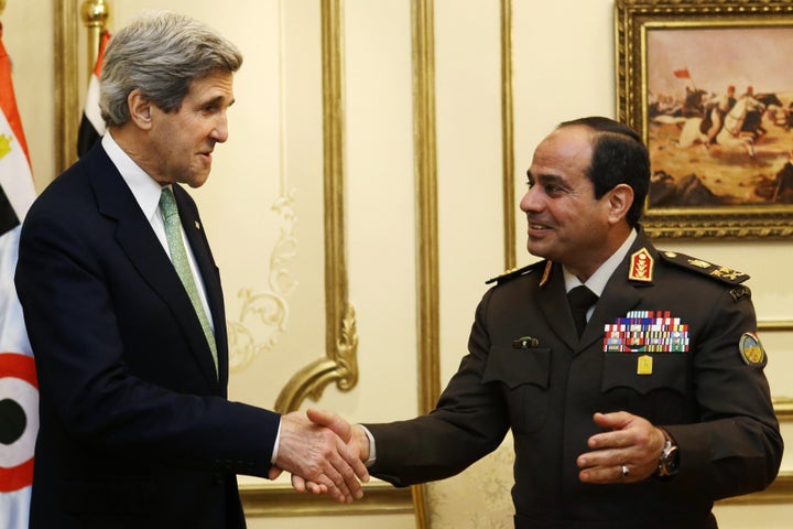 U.S. Secretary of State John Kerry (L) shakes hands with Egypt's Defence Minister General Abdel Fattah al-Sisi at the Ministry of Defence in Cairo, March 3, 2013.