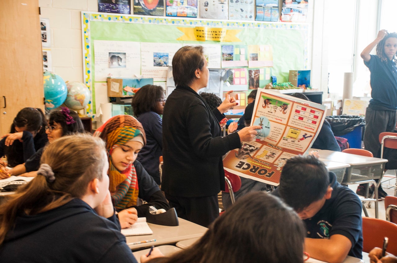 Nabiha gazes down at an empty notebook during second period science class.