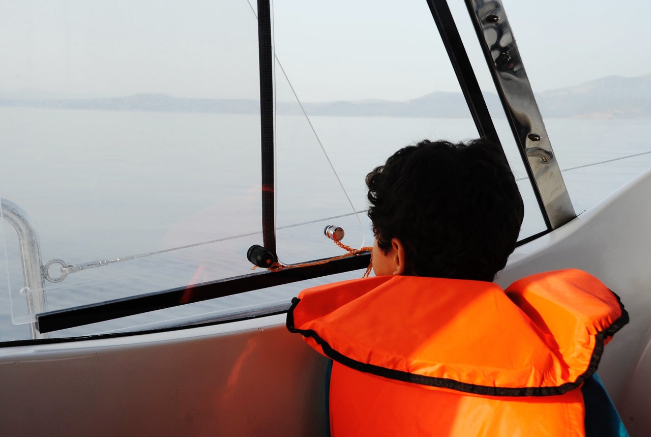 A young boy gazes out the Arade's window, getting his first glimpse of Europe.