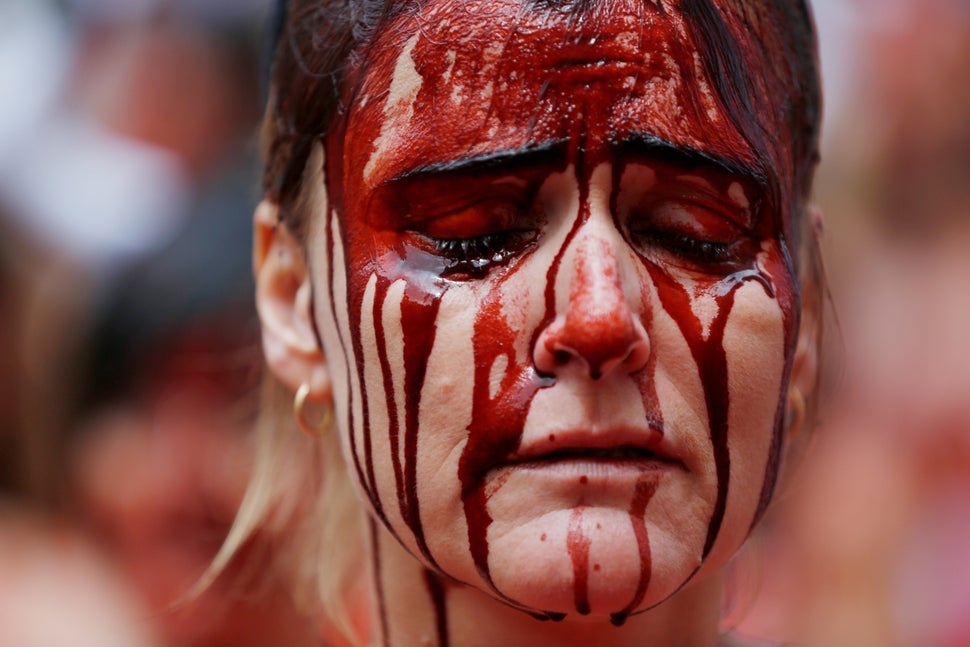 A day before the start of the running of the bulls San Fermin festival in Pamplona, northern Spain, activists grab bucke