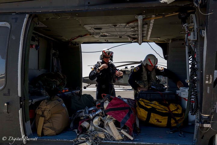 Fire Captain Eric McGuire and Cal Fire Military Helicopter Manager Chief Mike Harkness prepare for take off.