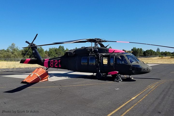 California Army National Guard UH-60 Black Hawk helicopter with its Bambi Bucket just prior to launch at Columbia Airport in support of Cal Fire on the Appaloosa Fire.
