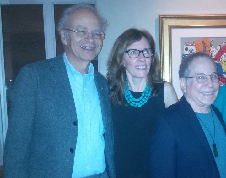 L-R: Peter Singer, Fistula Foundation CEO Kate Grant, and singer Paul Simon pose for a photo at a private benefit concert for Fistula Foundation in 2015.