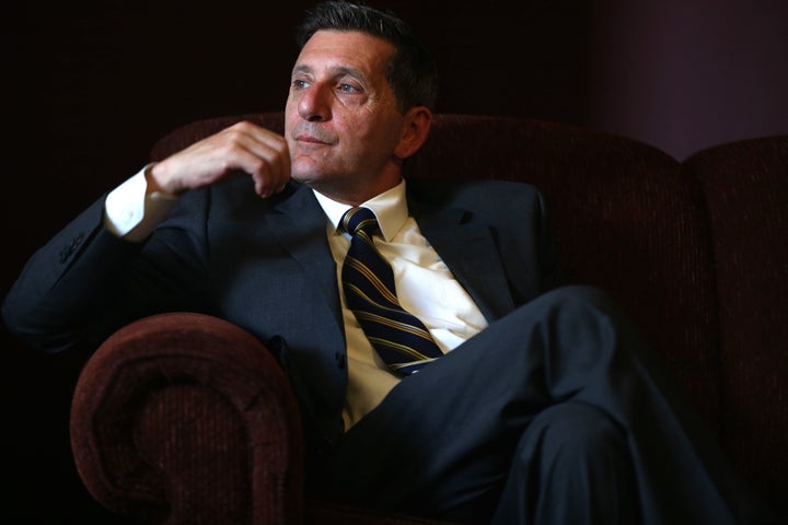 Michael Botticelli, the White House's director of National Drug Control Policy, listens to the residents of Grace House, a recovery center in Lynn, Massachusetts, Aug. 6, 2014.