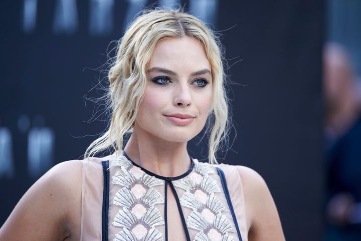 Margot Robbie poses for photographers as she arrives at the premiere of