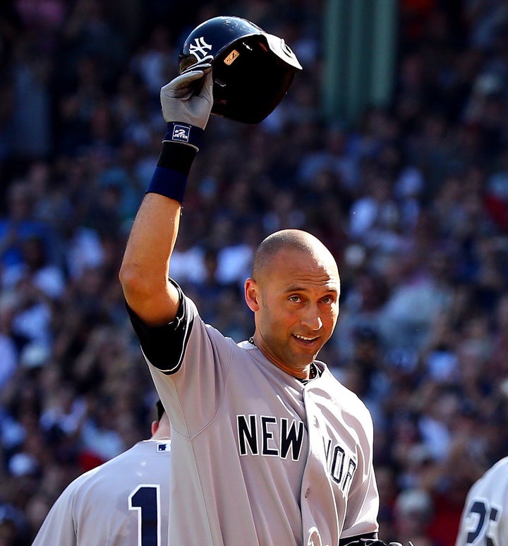 Derek Jeter waves to the crowd after hitting a single for his last career at bat against the Boston Red Sox, September 28, 2014.