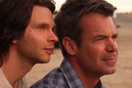 Devon Graye and Tuc Watkins in a scene from Retake