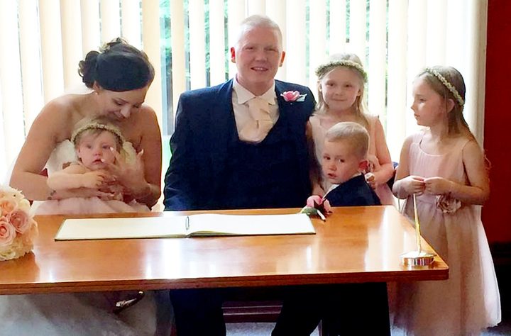 Aimee and Craig Partridge with their children on their wedding day (L to R) Nualah, one, son Harloe, two, Brogan-Lei, seven, and Niabhy, five.