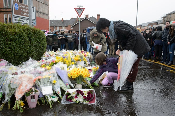 Tributes left to the shopkeeper at the scene