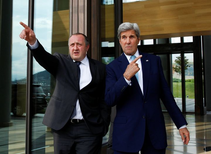 U.S. Secretary of State John Kerry (R) and Georgia's President Georgy Margvelashvili walk out of a residence during a meeting in Tbilisi, Georgia, July 6, 2016.
