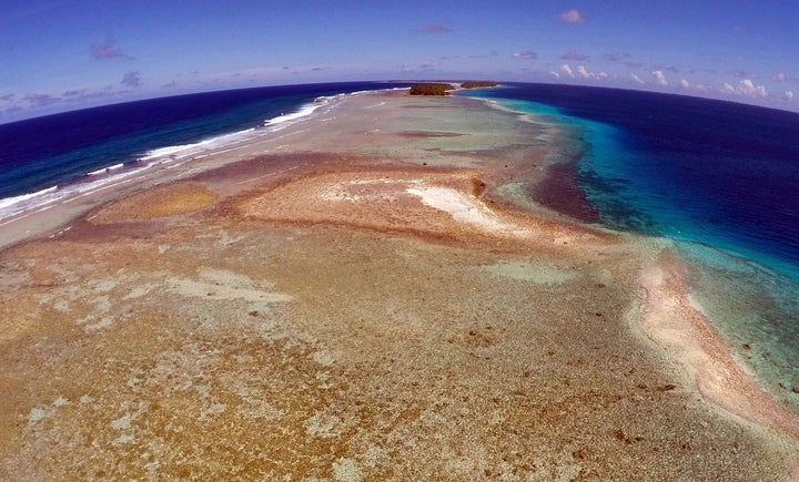 A small uninhabited island that has slipped beneath the water line and only shows a small pile of rocks at low tide on Majuro Atoll in the Marshall Islands.