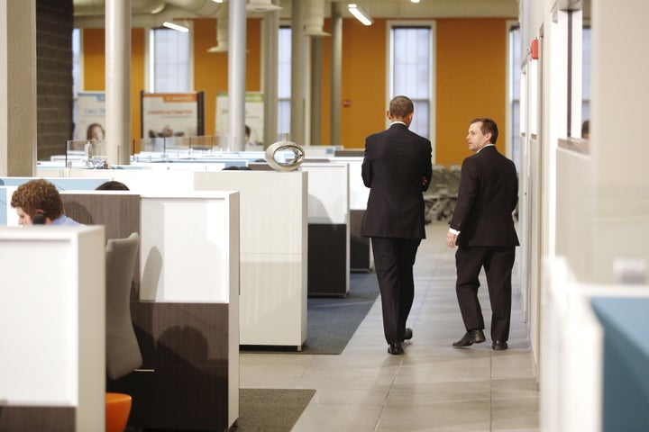 U.S. President Barack Obama (2nd R) walks with software development company InDatus President Phil Hawkins (R) on a tour of the tech firm in Louisville, Kentucky April 2, 2015.