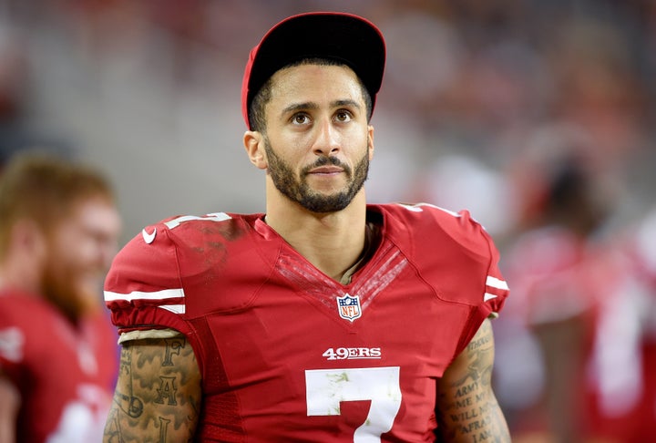 Colin Kaepernick of the San Francisco 49ers looks on from the sidelines against the San Diego Chargers, December 2014.