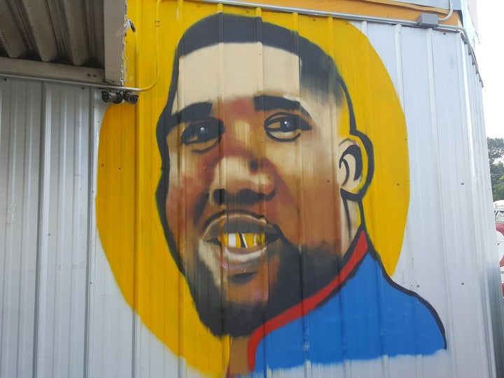 A recently painted mural of Alton Sterling graces the side of the Triple S convenience store in Baton Rouge.