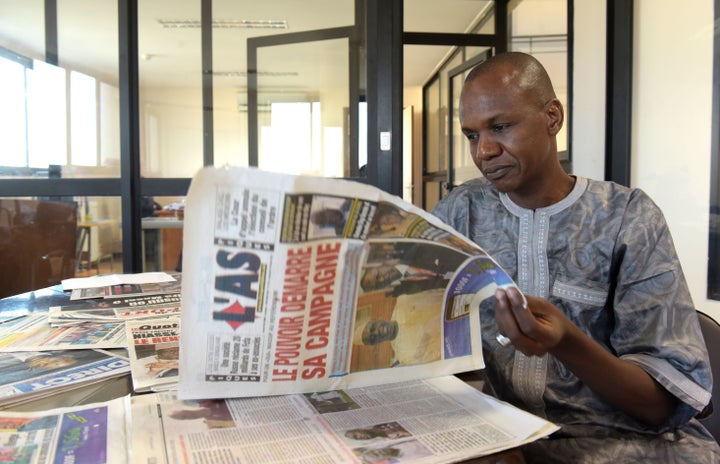 This file photo shows a journalist posing in his office in Dakar. He is one of hundreds of African journalists to have enjoyed all-expenses-paid trips to China courtesy of the Communist Party.