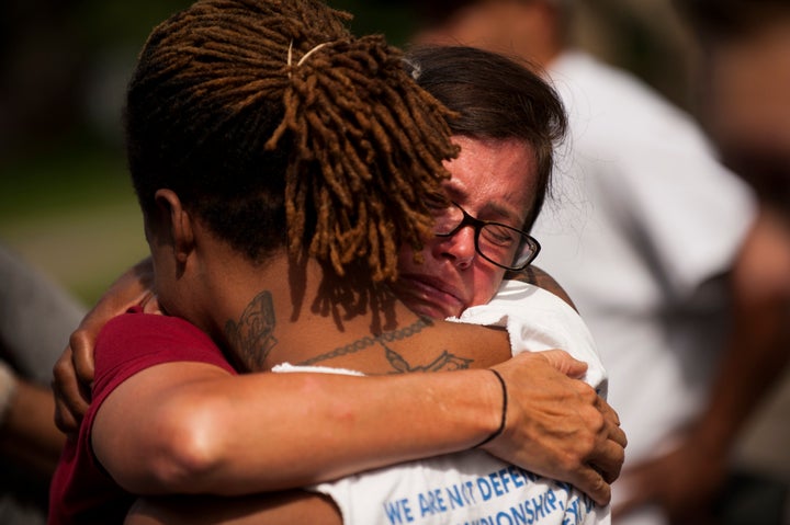 Two people embrace during a demonstration for Philando outside the Governor's Mansion.