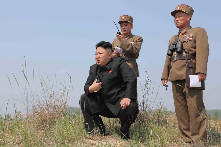 North Korean leader Kim Jong Un guides the multiple-rocket launching drill of women's sub-units under KPA Unit 851, in this undated photo released by North Korea's Korean Central News Agency April 24, 2014.