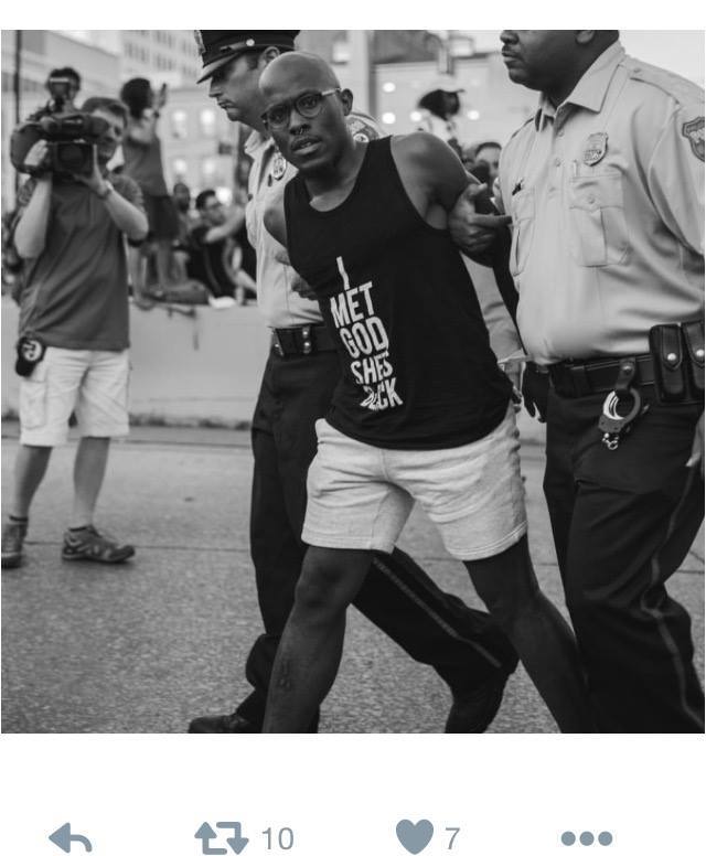 A black, gay Harlem pastor being arrested for civil disobedience after failing to disperse from obstructing a highway entrance during a #BlackLivesMatter protest in Philadelphia on 7.7.16.