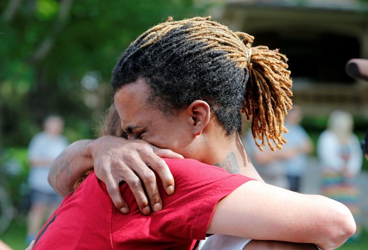 A cousin and a co-worker of Philando Castile try to console each other during a July 7 protest in St. Paul, Minnesota.