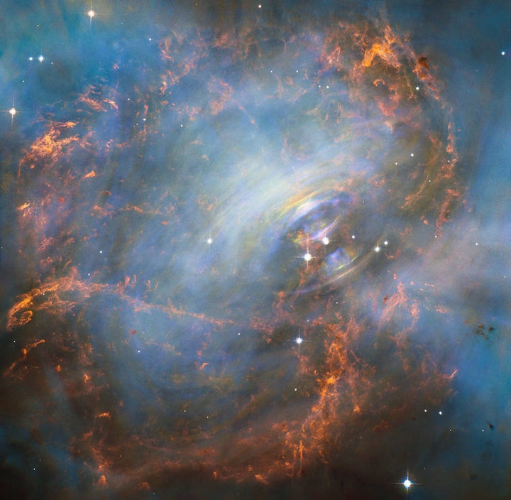 The Hubble Space Telescope's spectacular image of the Crab Nebula. Spinning 30 times a second, the neutron star shoots o