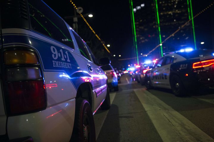 Police cars sit on Main Street in Dallas following the sniper shooting during a protest on July 7, 2016.