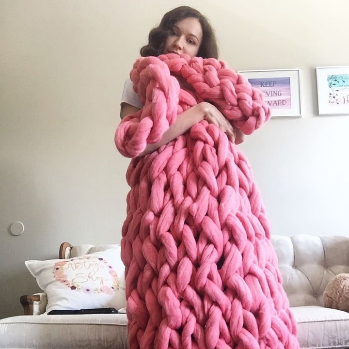 Anna with her arm knitted Merino blanket