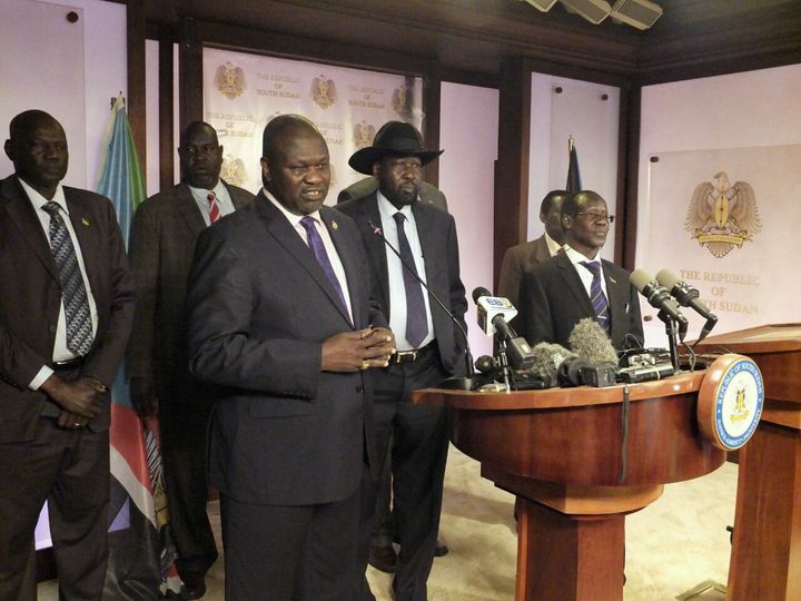South Sudan First Vice President Riek Machar (L) and President Salva Kiir (C) told reporters on Friday in Juba that they weren't aware of the cause of the fighting.