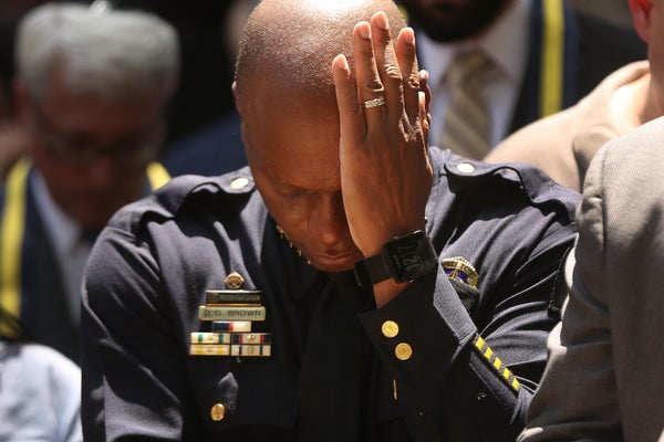 Dallas Police Chief David Brown pauses at a prayer vigil following the deaths of five police officers last night during a Bla
