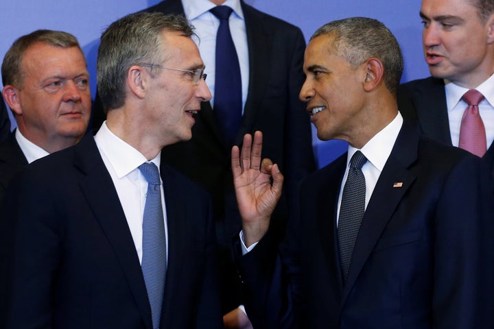 U.S. President Barack Obama (R) and NATO Secretary General Jens Stoltenberg (L) participate in a family photo before a NATO Summit working dinner at the Presidential Palace in Warsaw, Poland July 8, 2016.