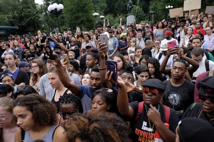 People take part in a protest against the killing of Alton Sterling, Philando Castile and in support of Black Lives Matter du