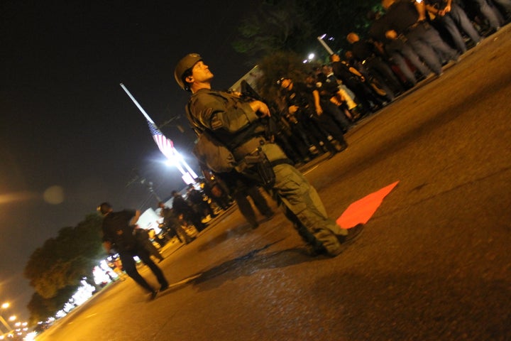 Police in tactical gear face down protesters in Baton Rouge on Friday.